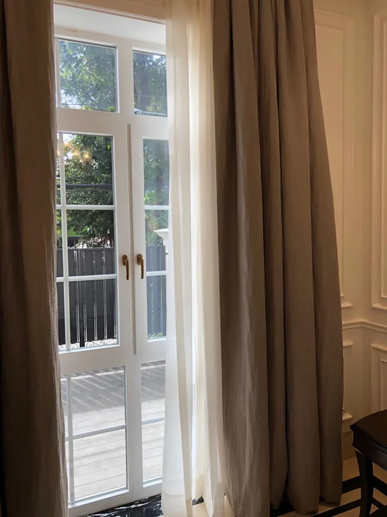 Interior view of Pakubuwono Residence with white UPVC windows