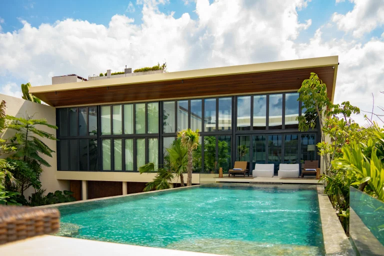 Pool view of Bali villa with grey UPVC windows